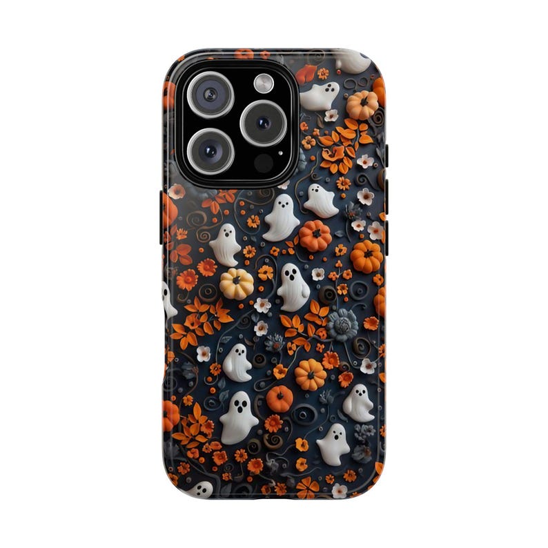 May include: A black phone case with a Halloween-themed design. The case features white ghosts, orange pumpkins, and orange floral accents against a dark blue background. The case has a glossy finish and a camera cutout.