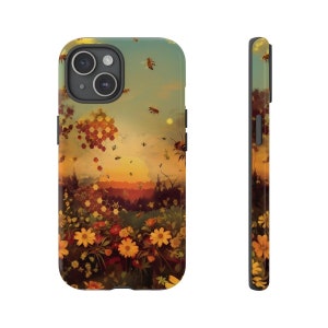 May include: A phone case with a sunset scene featuring a honeycomb pattern, bees, and flowers. The case is black and has a raised camera bump.