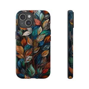 May include: A phone case with a colorful abstract design featuring a pattern of leaves in shades of blue, green, orange, and red.