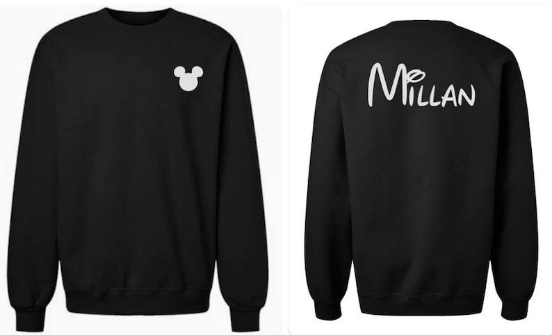 May include: A black long-sleeve crewneck sweatshirt featuring a small white Mickey Mouse head silhouette on the left chest and the word "MILLAN" in a white script font on the back, with the letter "i" dotted by a small Mickey Mouse head.
