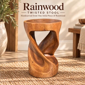 May include: A brown wooden stool with a twisted, hourglass-like silhouette, handcarved from a single piece of rainwood. The text Rainwood TWISTED STOOL Handcarved from One Solid Piece of Rainwood is displayed above the stool in dark brown lettering.