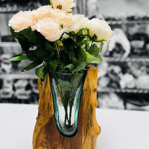 May include: A rustic wooden sign with the text "Welcome to our home" in white lettering. The sign features a distressed finish and a simple, inviting design, perfect for entryway decor.