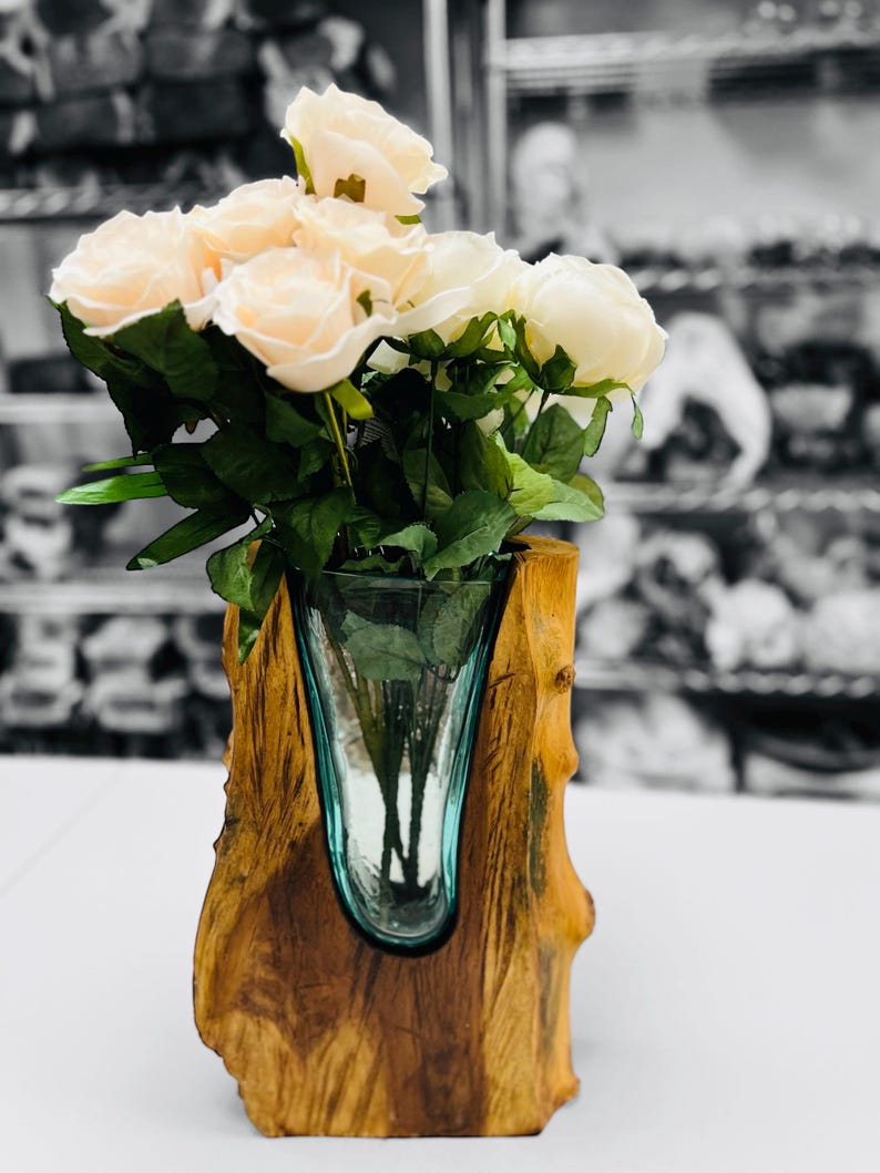 May include: A rustic wooden sign with the text "Welcome to our home" in white lettering. The sign features a distressed finish and a simple, inviting design, perfect for entryway decor.