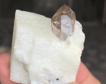 Smoky quartz on feldspar