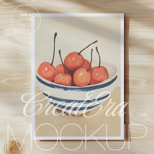May include: A print featuring a still life of cherries in a white bowl with blue stripes. The cherries are a vibrant red, and the bowl is set against a neutral background. The words "Create Era Mockup" are visible.