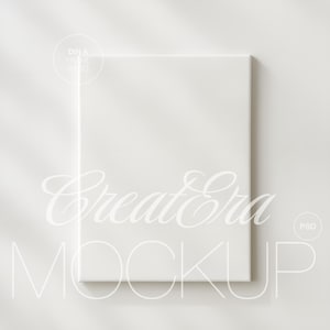 Op de afbeelding: Een witte canvas mockup met de tekst "Create Era Mockup" in een sierlijk lettertype. De afbeelding heeft een zacht, neutraal kleurenpalet, met subtiele schaduwen en een minimalistische esthetiek, perfect voor het presenteren van kunst of ontwerpen.