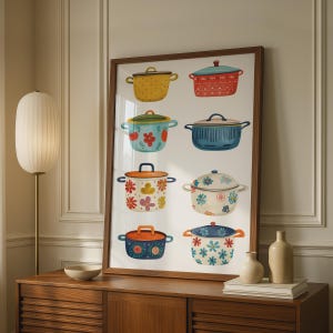 May include: A framed wall art print featuring eight distinct cooking pots arranged in two columns. The pots display various colours including yellow, red, blue, orange, and white, decorated with floral patterns, dots, and solid finishes.