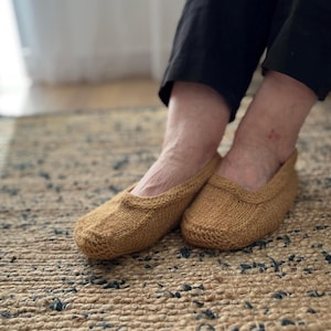 Beige hand knitted socks slippers