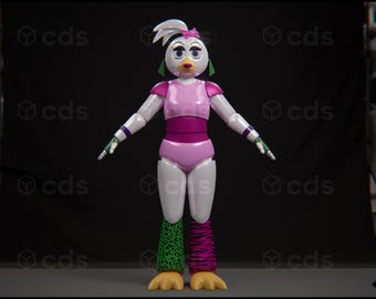 May include: A white animatronic bird with pink and green accents. The bird is wearing a pink leotard with a pink belt and a pink bow in its hair. The bird has green and black striped legs.