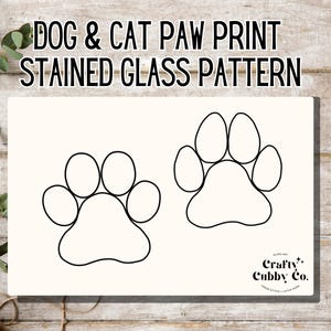 May include: Black and white line art pattern of a dog paw print and a cat paw print. The image is titled "Dog & Cat Paw Print Stained Glass Pattern" and includes the text "Crafty Cubby Co."