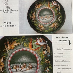 May include: A Folk Art Designs packet showing a painted plate design with Santa Claus in a sleigh pulled by reindeer. The plate has a dark green background with decorative elements and the text "Ho Ho Himself". Includes instructions and patterns.