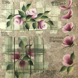 May include: A reusable teaching guide for reverse painting, featuring a floral design with pink roses and green leaves. The guide includes instructions in English, French, and Spanish, with step-by-step illustrations for creating the floral artwork.