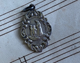 A vintage French silver religious medal