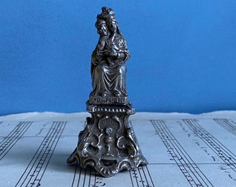 A small vintage French statue of Our Lady of Port