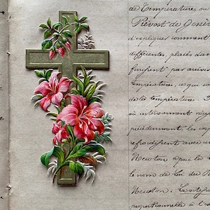 A vintage French devotional card, crucifix, flowers