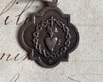 A small antique French Sacred Heart medal, silver religious medal