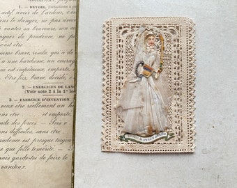 An antique French First Communion souvenir card, lace cut card