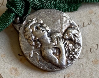 A vintage French religious medal, St John the Baptist, Abbé Pierre, 1956
