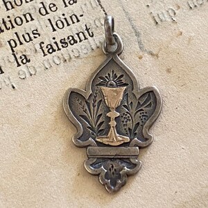 An antique French silver Eucharist medal, First Holy Communion souvenir