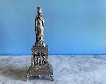 A vintage French metal statue of Our Lady