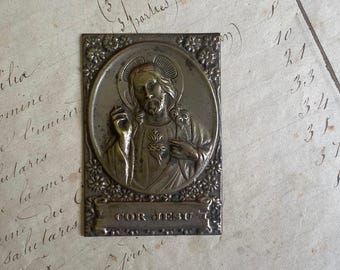 A small vintage French Sacred Heart plaque