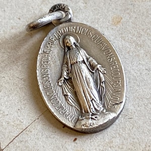 A very small vintage French miraculous medal