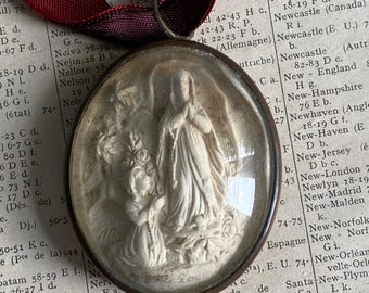An antique French meerschaum relief of St Bernadette and the Virgin Mary