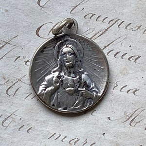 A vintage French Sacred Heart medal