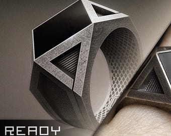 May include: Geometric design ring with a black square and triangle accents. The ring has a textured, metallic finish. The image also includes the text "READY TO SHIP".