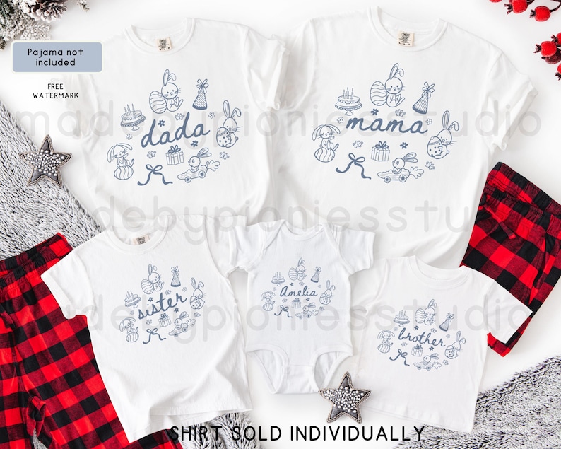 May include: White family shirts with blue bunny and Easter-themed graphics. The shirts are labelled "dada", "mama", "sister", "brother", and "Amelia". Red and black plaid pajama bottoms are visible.