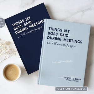 May include: Two hardcover notebooks, one navy blue and one light blue, with the text "THINGS MY BOSS SAID DURING MEETINGS so I'll never forget." The light blue notebook has the text "madebypioniesstudio" and "MICHELLE SMITH OFFICE ASSISTANT".