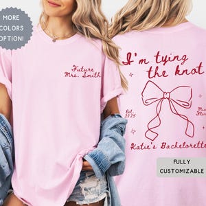 Comfort Colors® Personalized Coquette She&#39;s Tying the Knot Shirt, Custom Bow Getting Ready Outfit Bachelorette Party Favors,Destination Gift