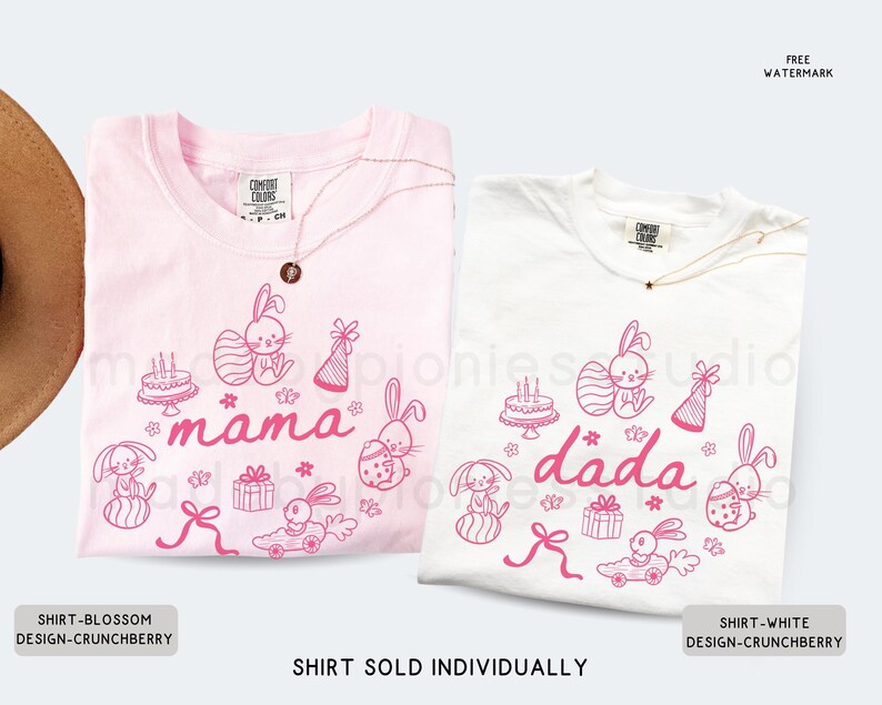 May include: Two t-shirts, one pale pink and one white, with matching pink graphic designs. The designs feature Easter bunnies, cakes, gifts, and the words "mama" and "dada". Each shirt has a gold necklace.