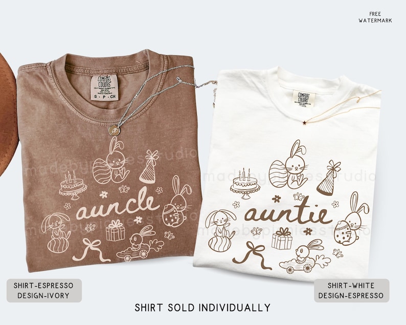 May include: Two t-shirts, one in espresso and one in white, each with a unique design. The espresso shirt says "auncle" and the white shirt says "auntie". Both shirts feature bunny illustrations and the text "SHIRT SOLD INDIVIDUALLY".