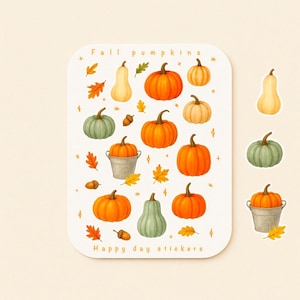 May include: A sticker sheet featuring watercolor illustrations of pumpkins in various shapes and colors, including orange, green, and cream. The sheet also includes fall leaves, acorns, and the text "Fall pumpkins" and "Happy day stickers".