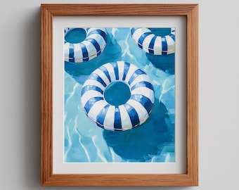 May include: A framed print featuring three blue and white striped inflatable rings floating in a pool of water. The artwork is a painting with a focus on the water's reflections and shadows, creating a summery, vacation theme.