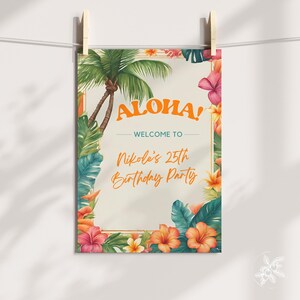 May include: A tropical-themed welcome sign with a gold frame and floral accents. The sign reads "Aloha! Welcome to Nikole's 25th Birthday Party".