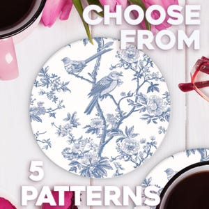 May include: Five different patterns of blue and white ceramic coasters with a floral design and birds. The text "Choose From 5 Patterns" is written on the image.