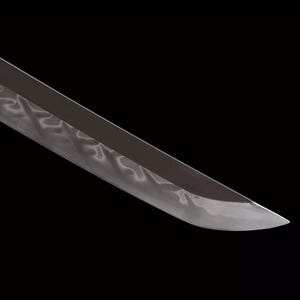 May include: Close-up of a katana blade with a polished, reflective surface. The blade has a subtle wave pattern along its length, and the tip is sharply pointed. The background is solid black, emphasizing the blade's form.
