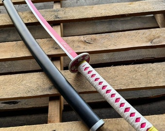 May include: A pink and white katana sword with a black scabbard. The sword has a white handle with pink diamond patterns and a gold pommel. The scabbard is black with a silver accent.