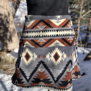 Fleece Bum Warmer skirt. A-line with pocket large enough or a phone. beaded drawstring waist. Print: Black Raymi Southwest