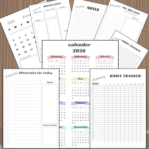 Peut inclure: Plusieurs pages de planificateur non datées, avec un calendrier 2026, des listes de tâches et des suivis d'habitudes. Les pages blanches comportent des titres tels que "Objectifs mensuels" et "Notes".