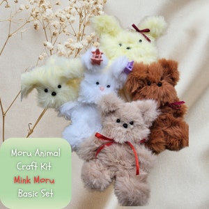 May include: A set of five plush animal craft kits, including a white bunny, two yellow dogs, a brown bear, and a beige bear. The kits are labeled "Moru Animal Craft Kit, Mink Moru Basic Set".