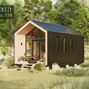 Exterior render of a modern tiny house with dark vertical siding, a pitched roof, and a large front glass wall in a grassy field.