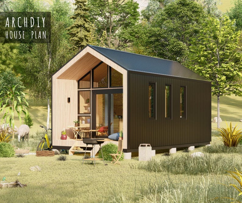 Exterior render of a modern tiny house with dark vertical siding, a pitched roof, and a large front glass wall in a grassy field.