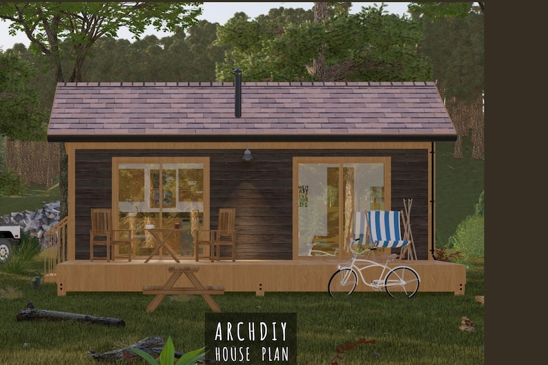 May include: A digital rendering of a small cabin with a brown roof and dark wood siding. The cabin has large windows and a porch with a picnic table, chairs, and a bicycle. The text "ARCHDIY HOUSE PLAN" is visible.