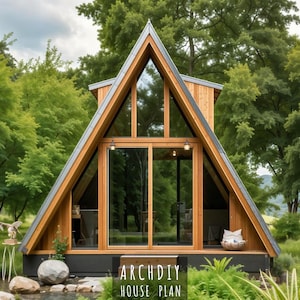 Peut inclure: Cabane en A avec de grandes fenêtres et portes vitrées, entourée d'une végétation luxuriante. La structure en bois a un toit triangulaire et se dresse sur fond d'arbres. Le texte "ARCHDIY HOUSE PLAN" est visible en bas.
