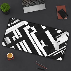May include: Black and white geometric design mouse pad. The design features a series of overlapping lines and shapes.