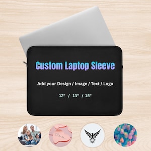 May include: Black laptop sleeve with the text "Custom Laptop Sleeve" in a gradient of blue and purple. The sleeve is designed to fit 12", 13", or 15" laptops. The text "Add your Design / Image / Text / Logo" is also included.