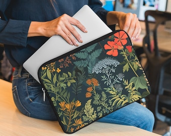 May include: A laptop sleeve with a floral pattern. The sleeve is black with a variety of colorful flowers and leaves. The sleeve is made of a soft, durable material and is perfect for protecting your laptop.